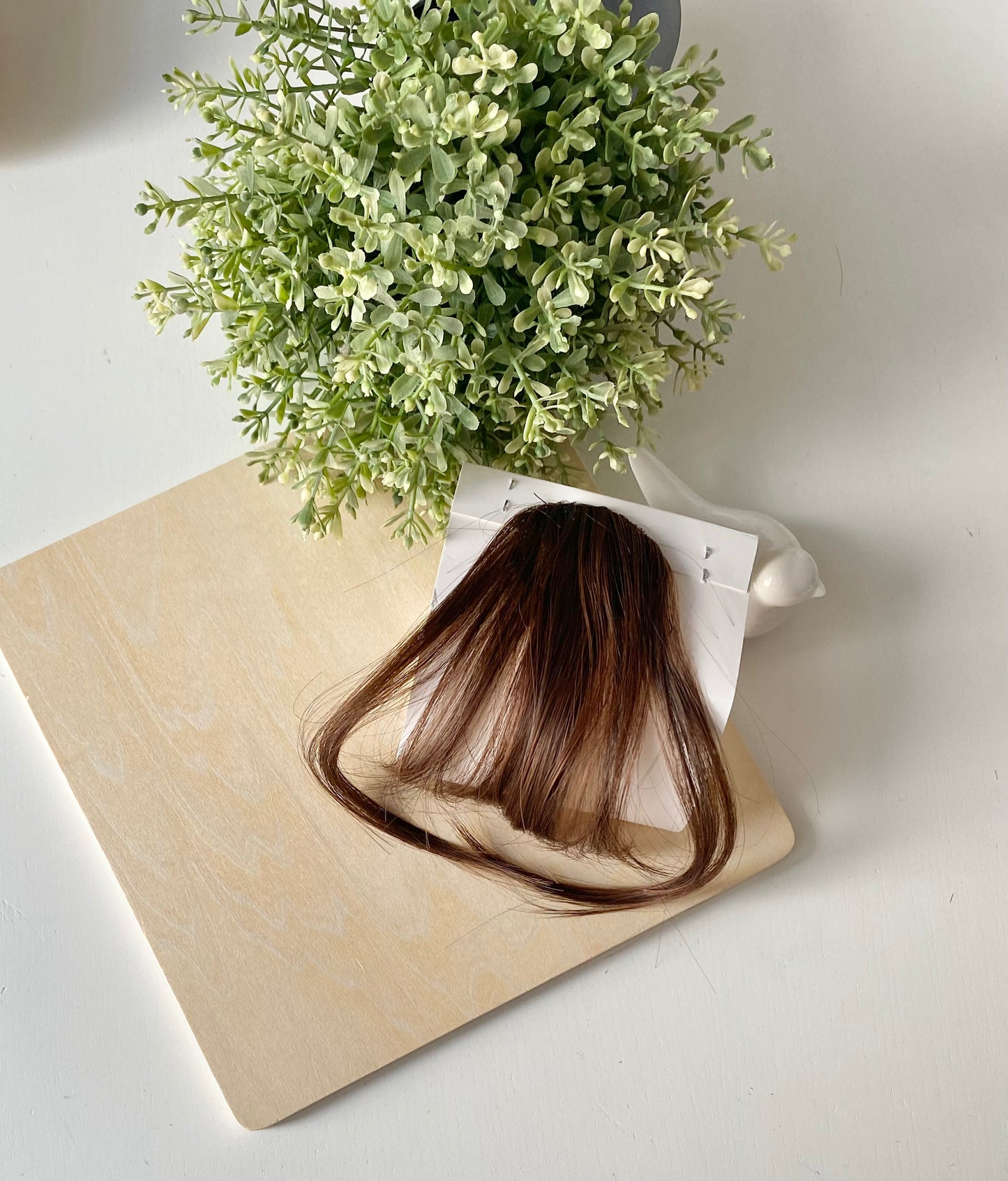 Frange de cheveux, une seule pince