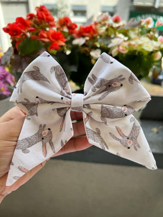 Colorful collection of fashionable hair accessories, including chic pigtail bows and sophisticated sailor bows for women