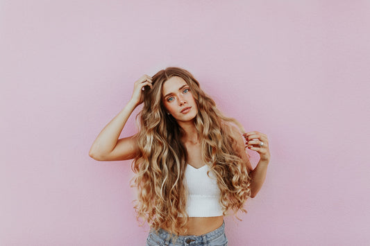 A European woman with long, voluminous hair, showcasing the beautiful results of high-quality hair extensions and proper maintenance for extended longevity.